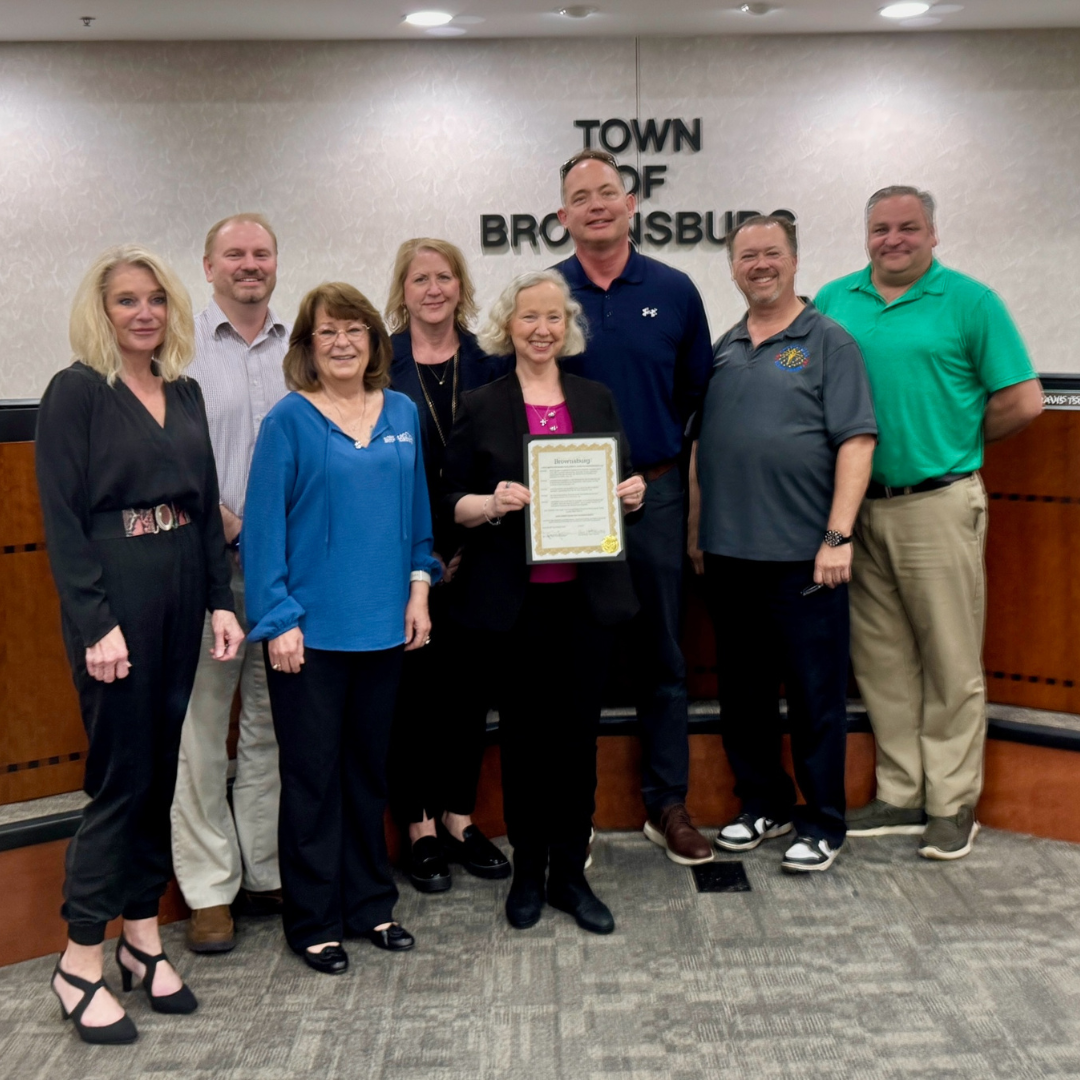 Group of people pose with proclamation